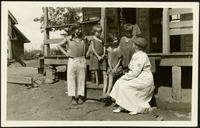 American Women's Hospitals Service and an Appalachian Mountain family (photograph), circa 1935<blockquote class="juicy-quote">An [unidentified] doctor (in hat) from the American Women’s Hospital Service sits on the front steps of a porch in rural 1930s Appalachia with a local woman and children.</blockquote><div class="view-evidence"><a href="https://doctress.org/islandora/object/islandora:1859/story/islandora:2084" class="btn btn-primary custom-colorbox-load"><span class="glyphicon glyphicon-search"></span> Evidence</a></div>