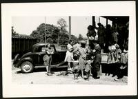American Women's Hospitals, Rural Services mobile clinic vaccinating a woman (photograph), circa 1935<blockquote class="juicy-quote">An American Women’s Hospital doctor (in hat and “AWH” armband) administers a shot to a local woman in Jellico, Tennessee.</blockquote><div class="view-evidence"><a href="https://doctress.org/islandora/object/islandora:1859/story/islandora:2086" class="btn btn-primary custom-colorbox-load"><span class="glyphicon glyphicon-search"></span> Evidence</a></div>